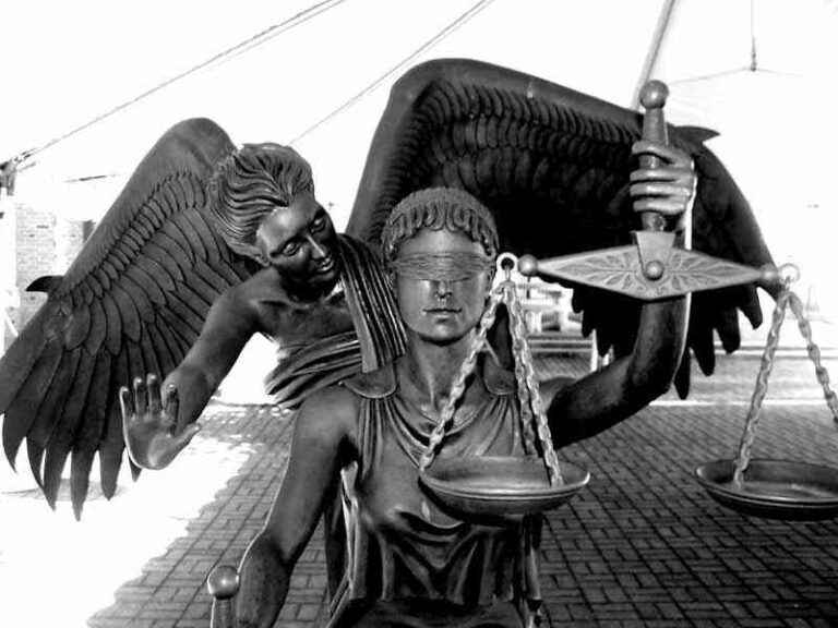 alt="A photo of the statue Lady Justice, for the post 'Justice with Mercy.'"