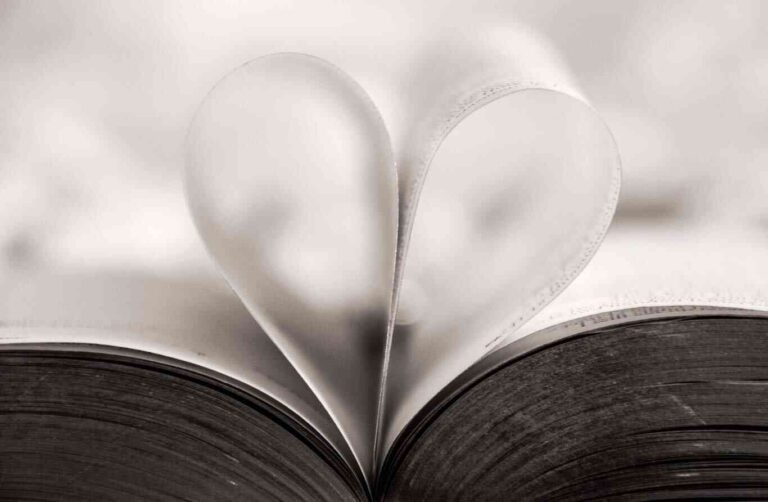 alt="A photo of a book with pages in shape of a heart. For blog 'But the Greatest of These is Love.'"